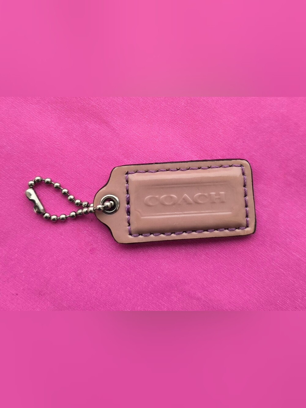 two Y2K coach hangtangs
